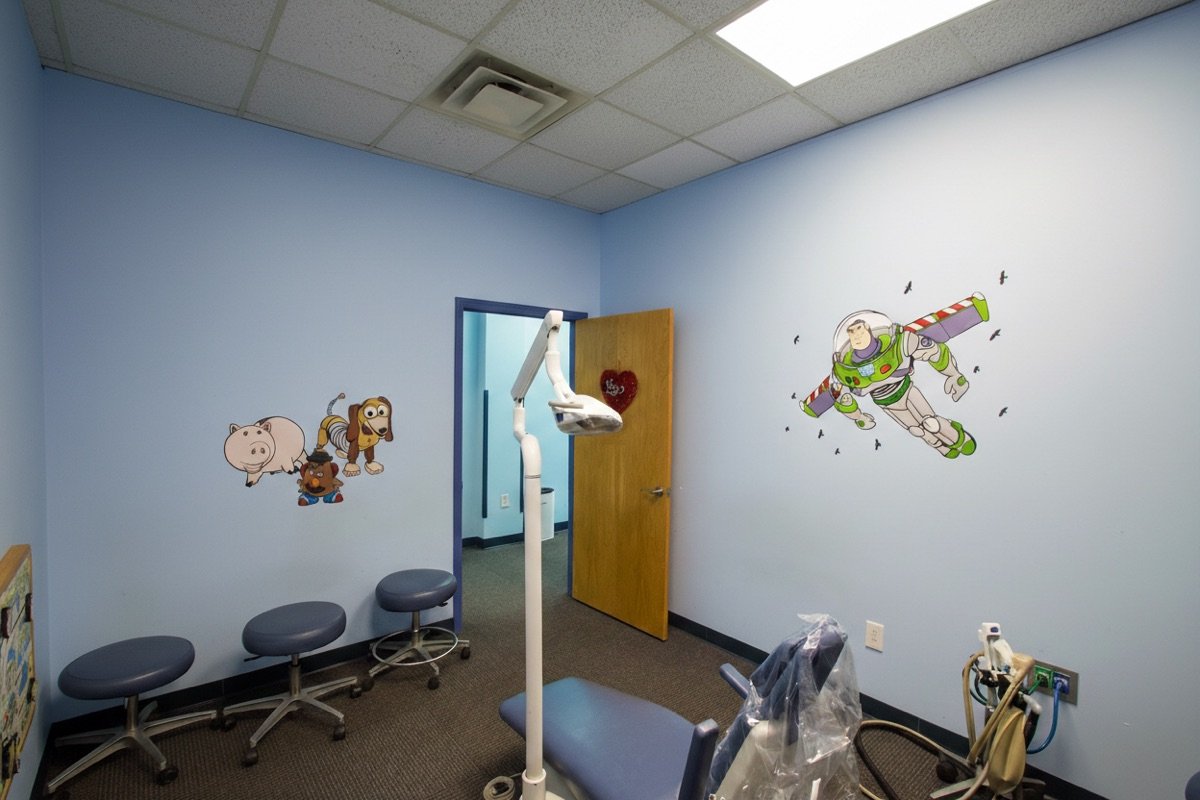 Greensboro exam room with Buzz Lightyear mural